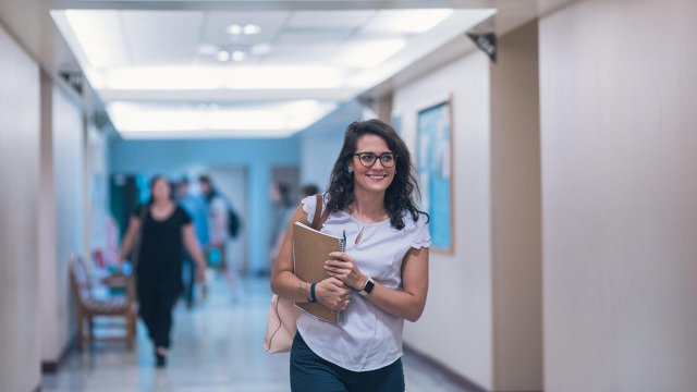 student walking through the halls of Columbine Hall