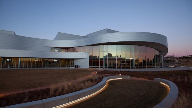 exterior of the Ent Center for the Arts at dusk