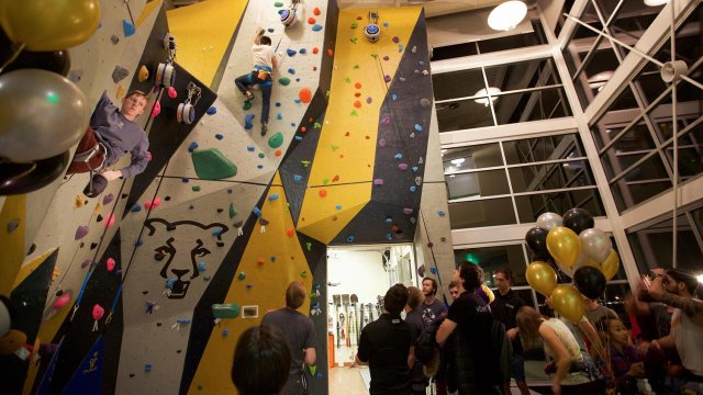 a climbing wall inside the recreation and wellness center