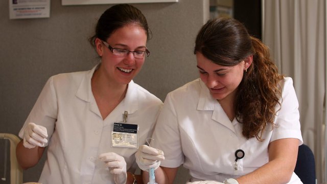 Nursing students working in a lab