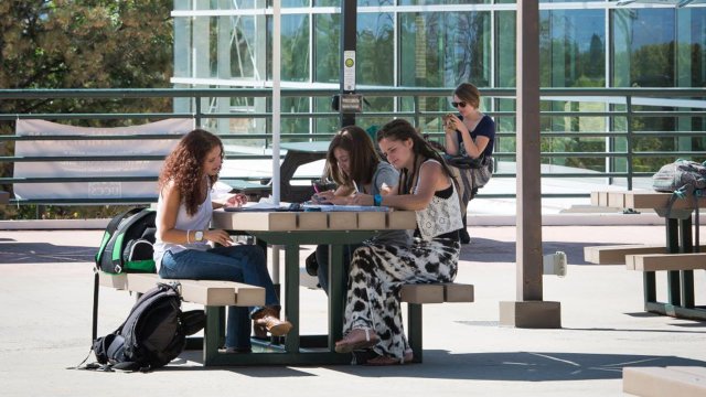 students hanging out and studying together outside on the Upper Plaza