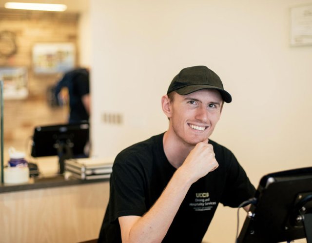 student employee working and smiling